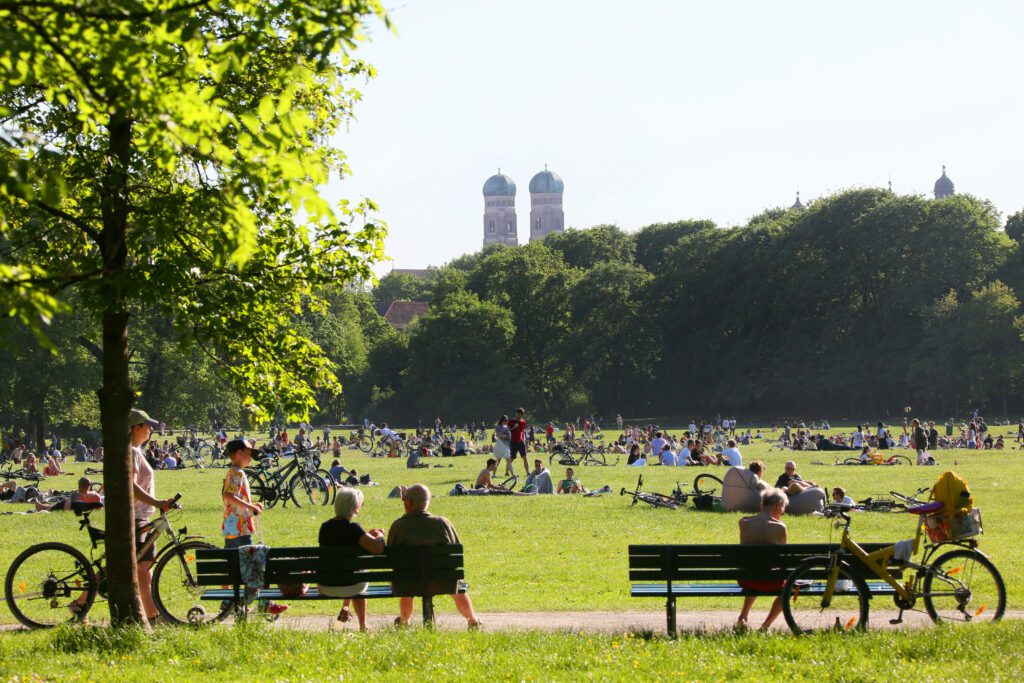 view on to English Garden in Munich, Germany with Frauenkirche in the background