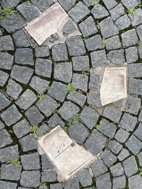 Three flyers sketched into the cobblestones as part of the White Rose Memorial 