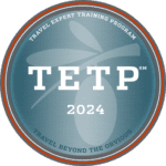 Medallion with TETP inscribed, signaling the completion of the Travel Expert Training Program