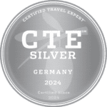 Medallion with CTE Silver inscribed, signaling that Eva and Germany Travel Co. was awarded the Silver status in the Travel Expert Training Program