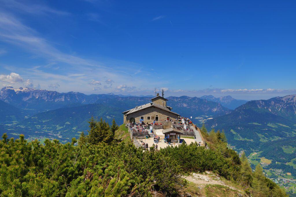 Eagle's Nest in Berchtesgade: perched on the edge of Kehlstein mountain, overlooking green fields and trees